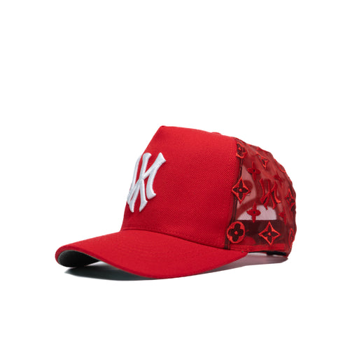 A red snapback cap with New York Yankees embroidery on the front.
